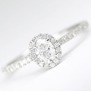 18ct White Gold Oval Diamond .49pts Halo Ring